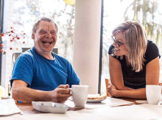 Adult Man Portrait with a Down Syndrome in a Daycare environment